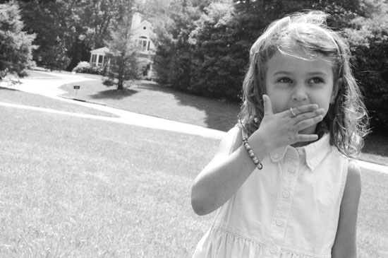 Little girl playing in the yard