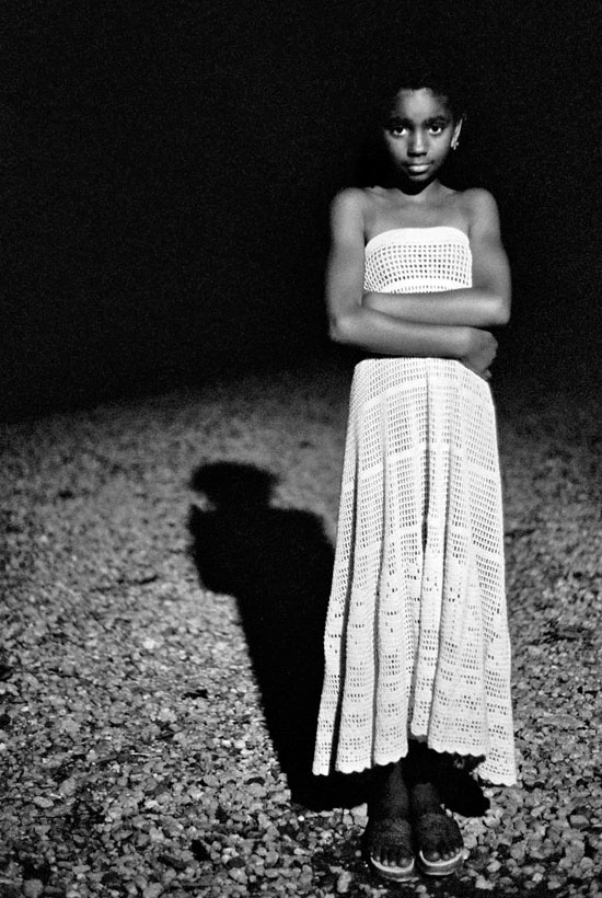 photo of a young girl standing on the road at night, huntington, ny